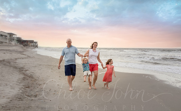 Family walking up & down the beach