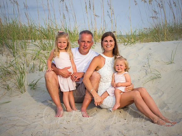 little kids standing while parents sit baby on lap